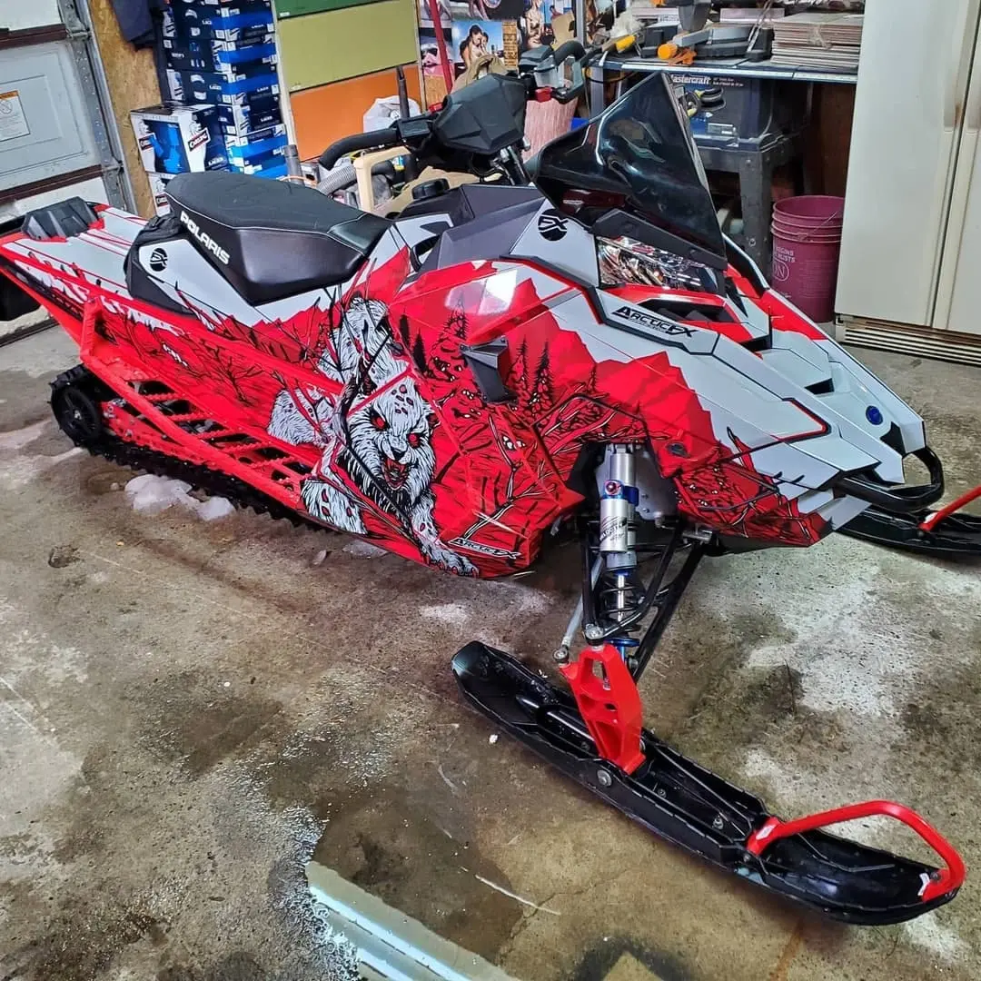 Snowmobile in a red wrap