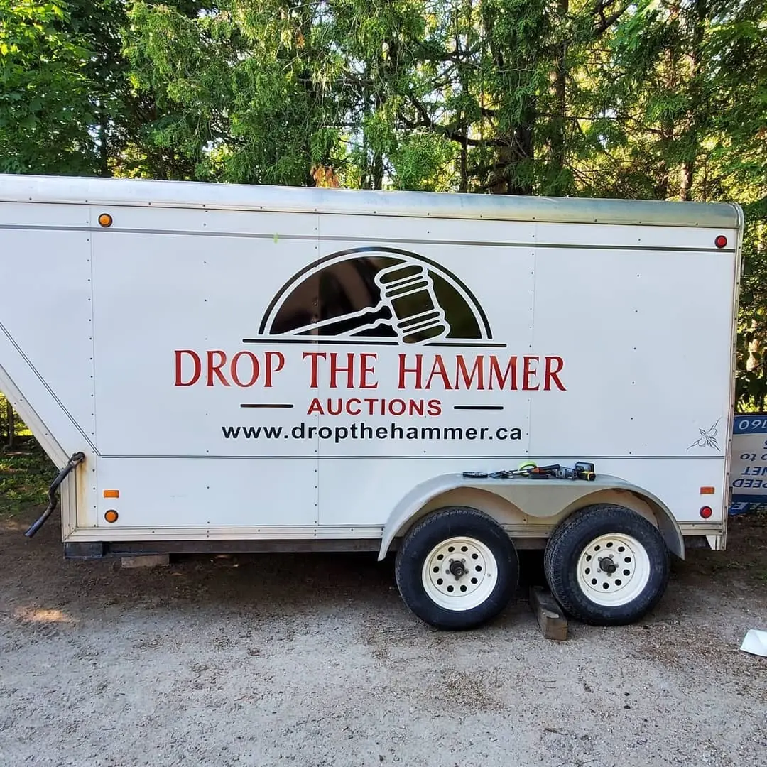 Enclosed trailer lettered for Drop The Hammer