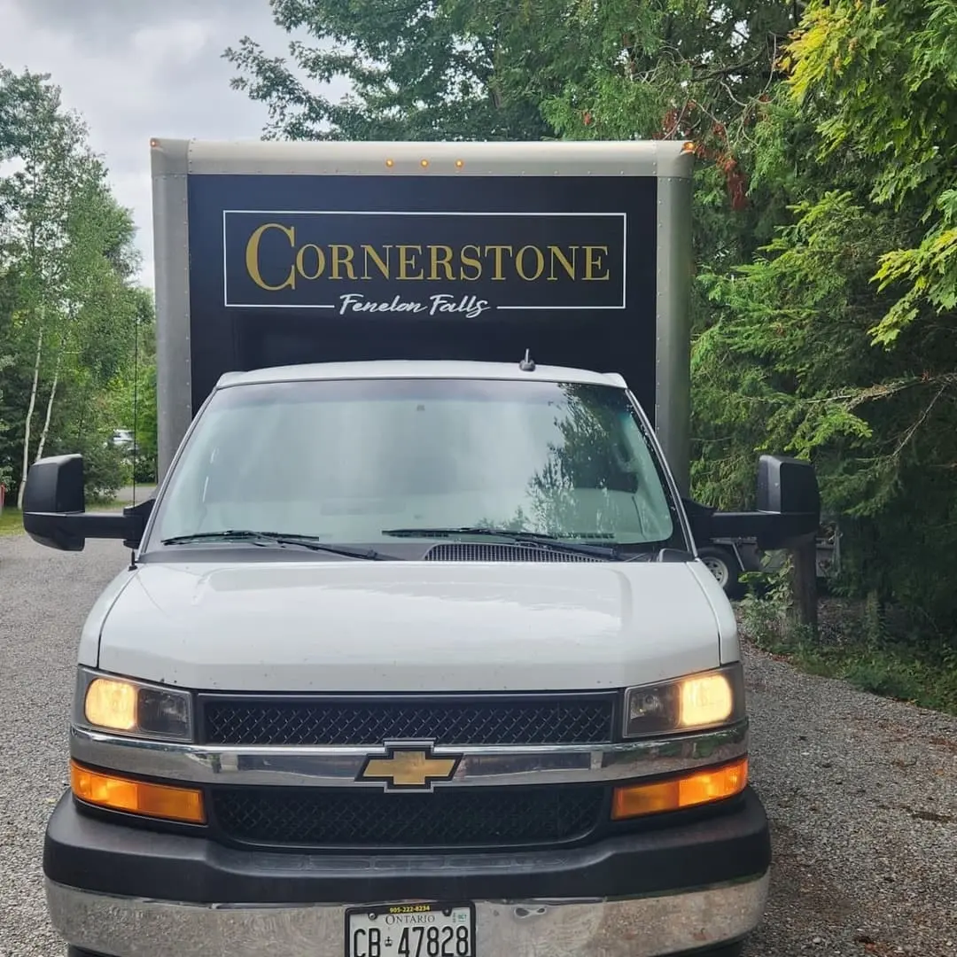 Cornerstone Furniture box truck in black with gold lettering