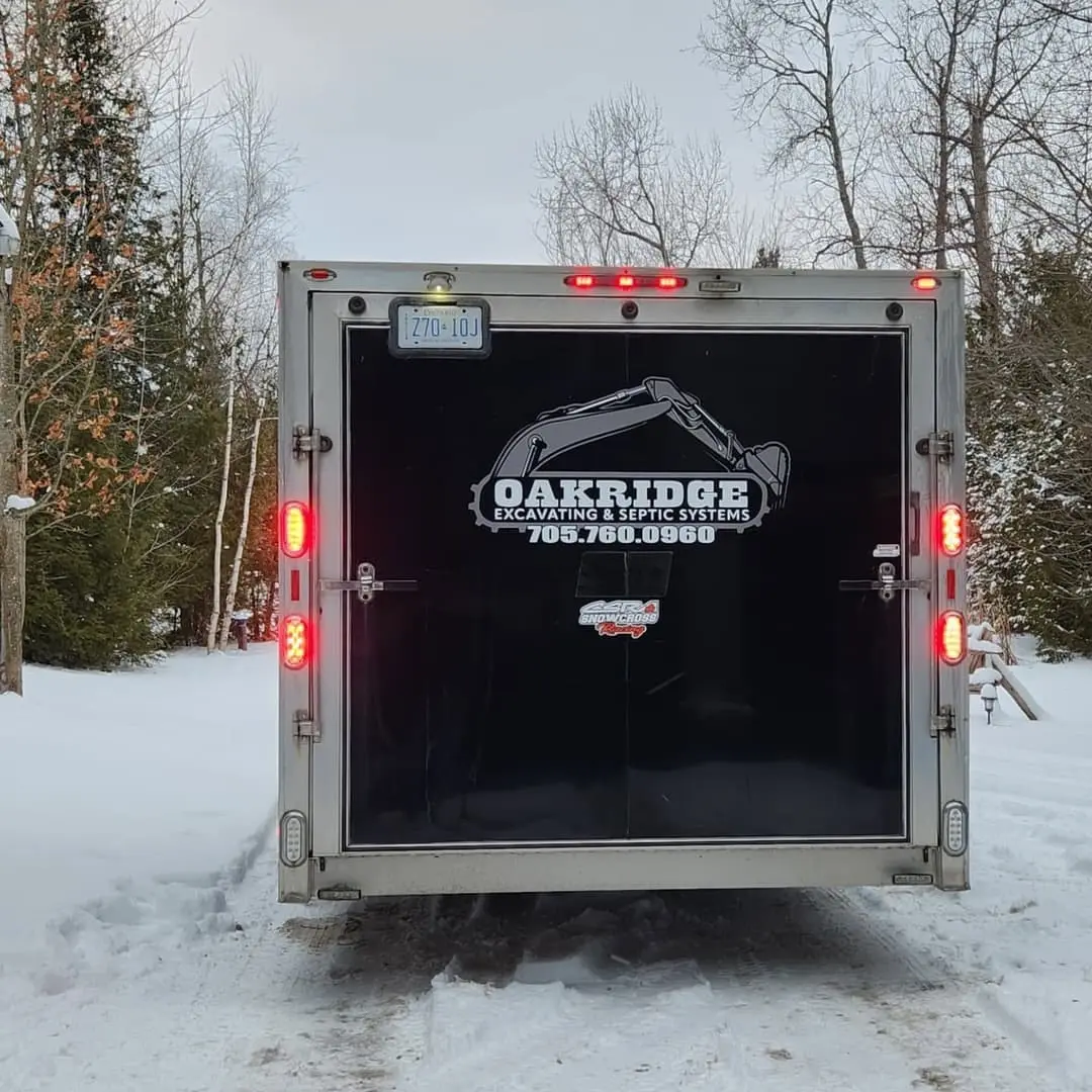 Enclosed trailer lettered for Oakridge Excavating