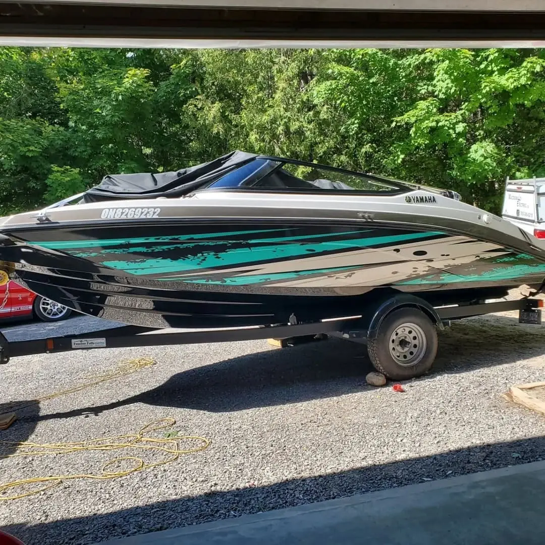 Boat in a green and black wrap