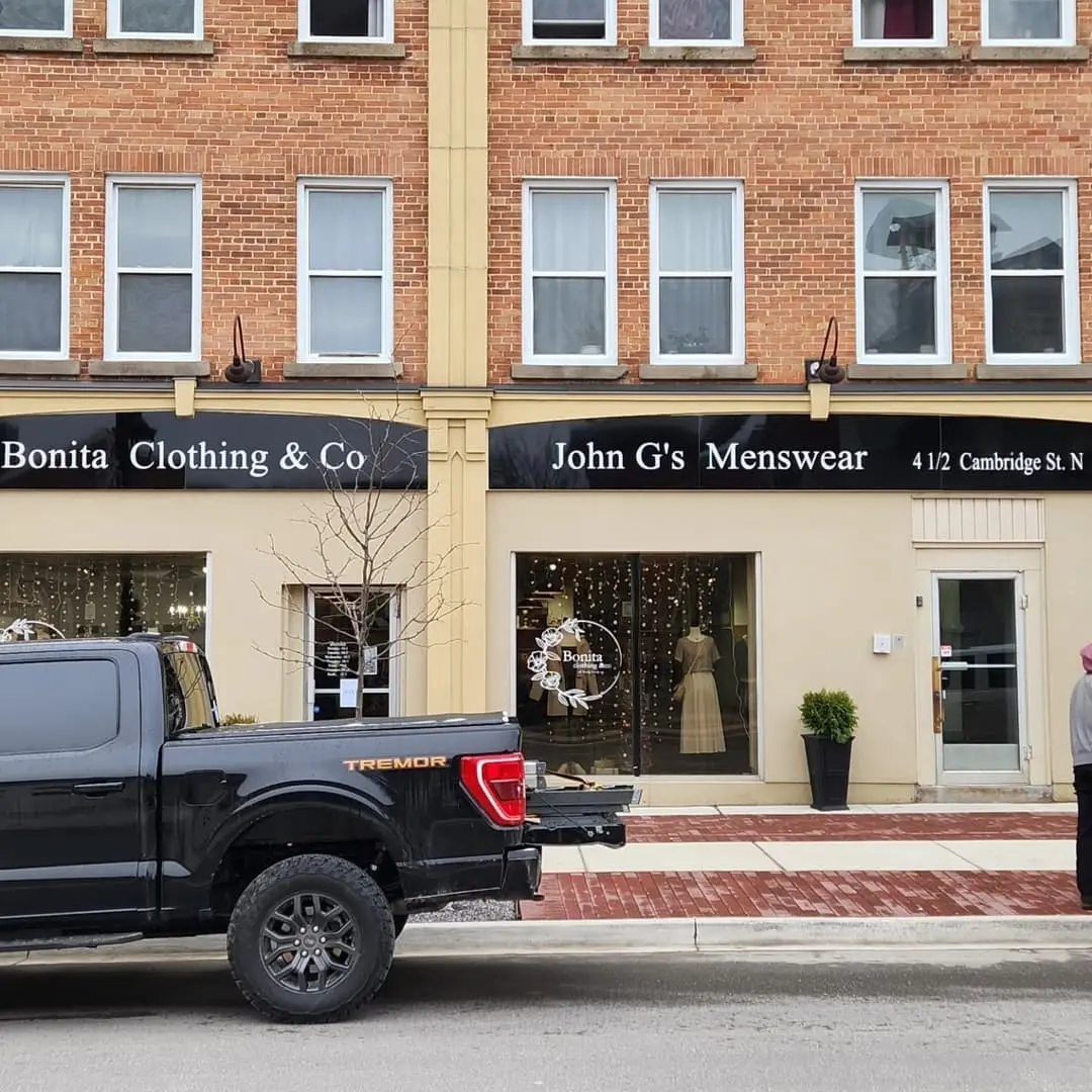 Storefront signs for Bonita Clothing & Co and John G's Menswear