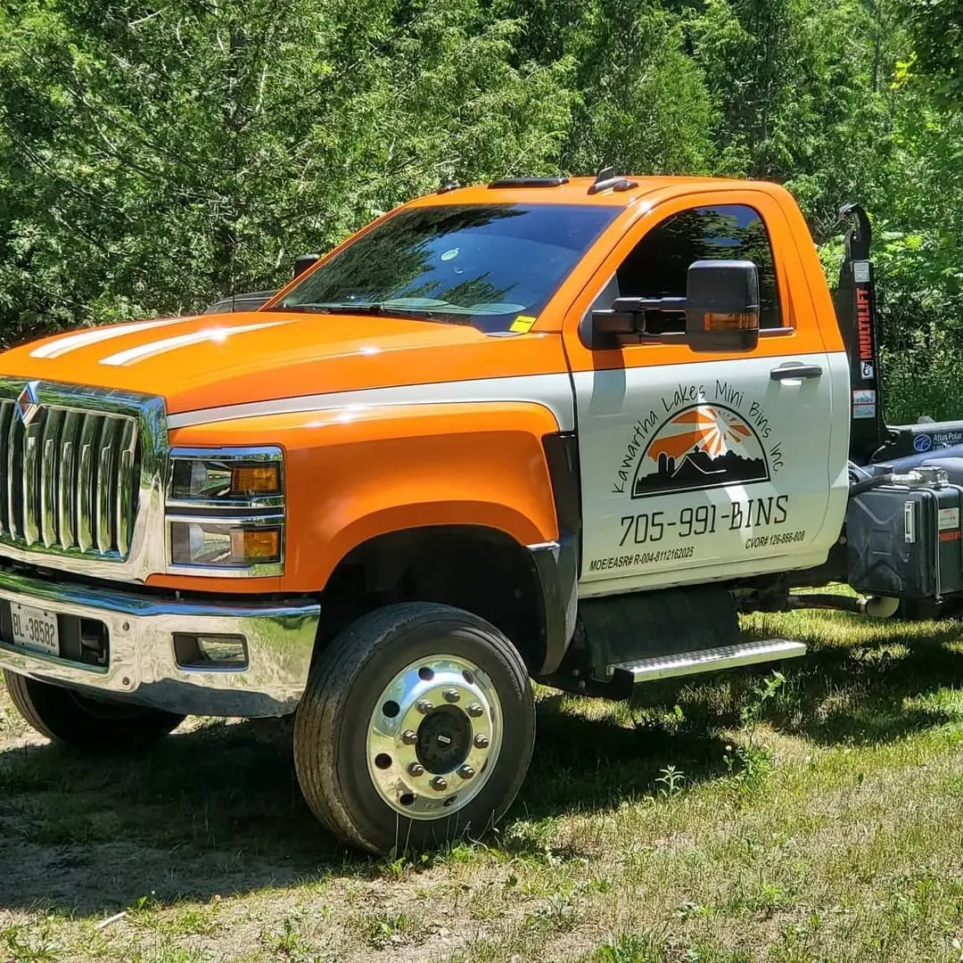 Orange tow truck with lettering