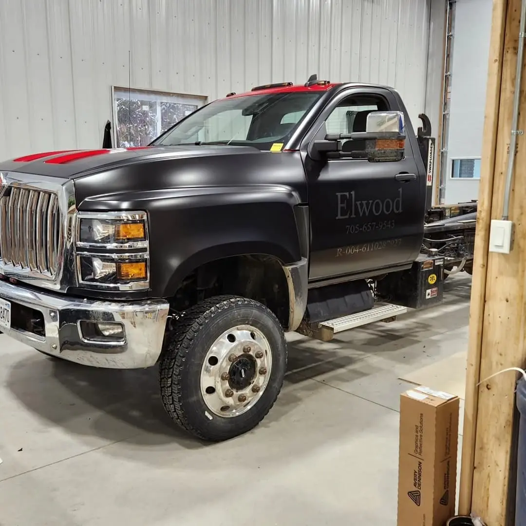Black International work truck lettered for Elwood