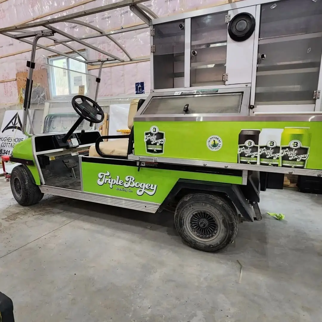 Golf cart with a green printed wrap