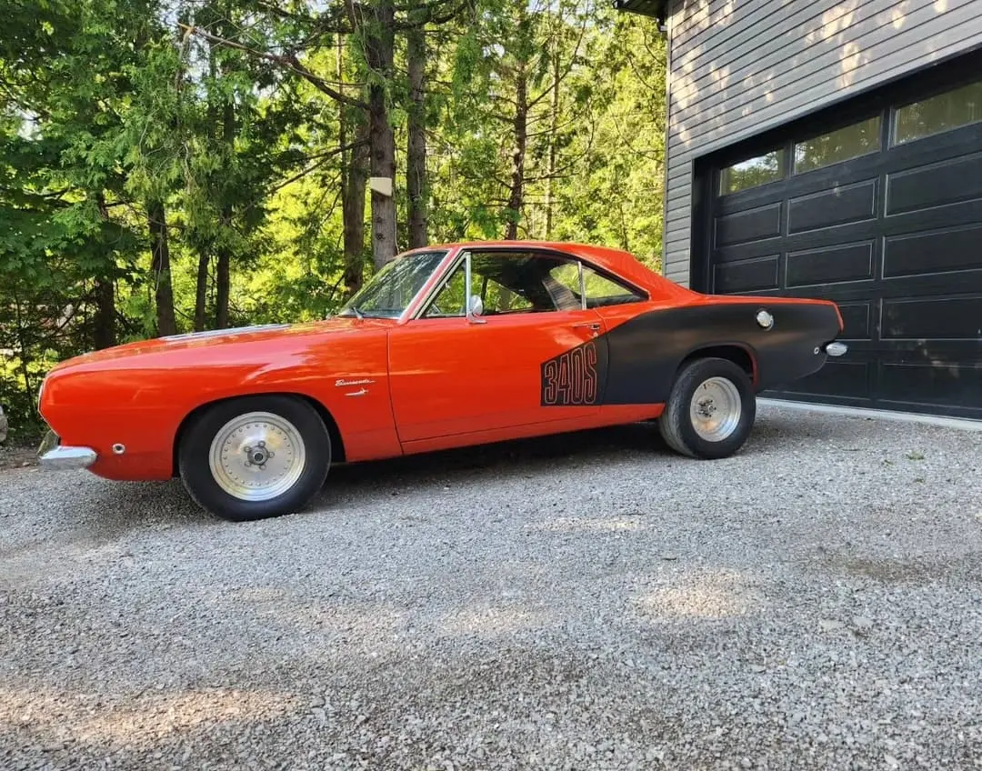 Orange classic muscle car with black stripes