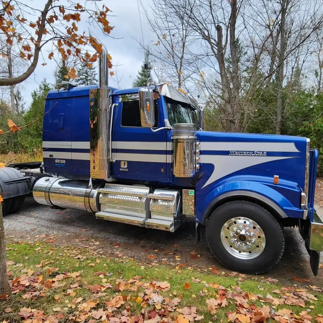 Blue Peterbilt lettered for Watson Trucking