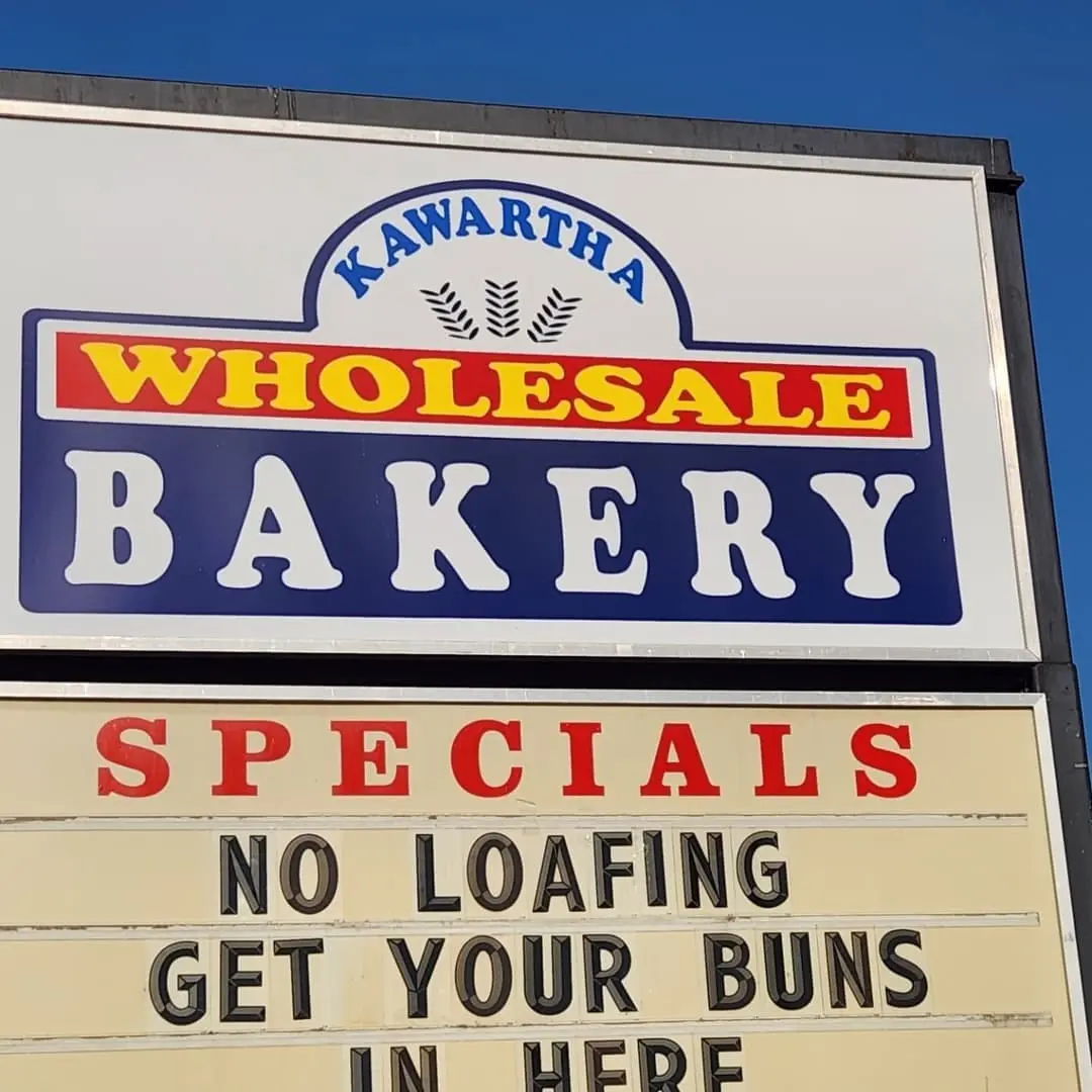 Kawartha Wholesale Bakery road sign with the specials board