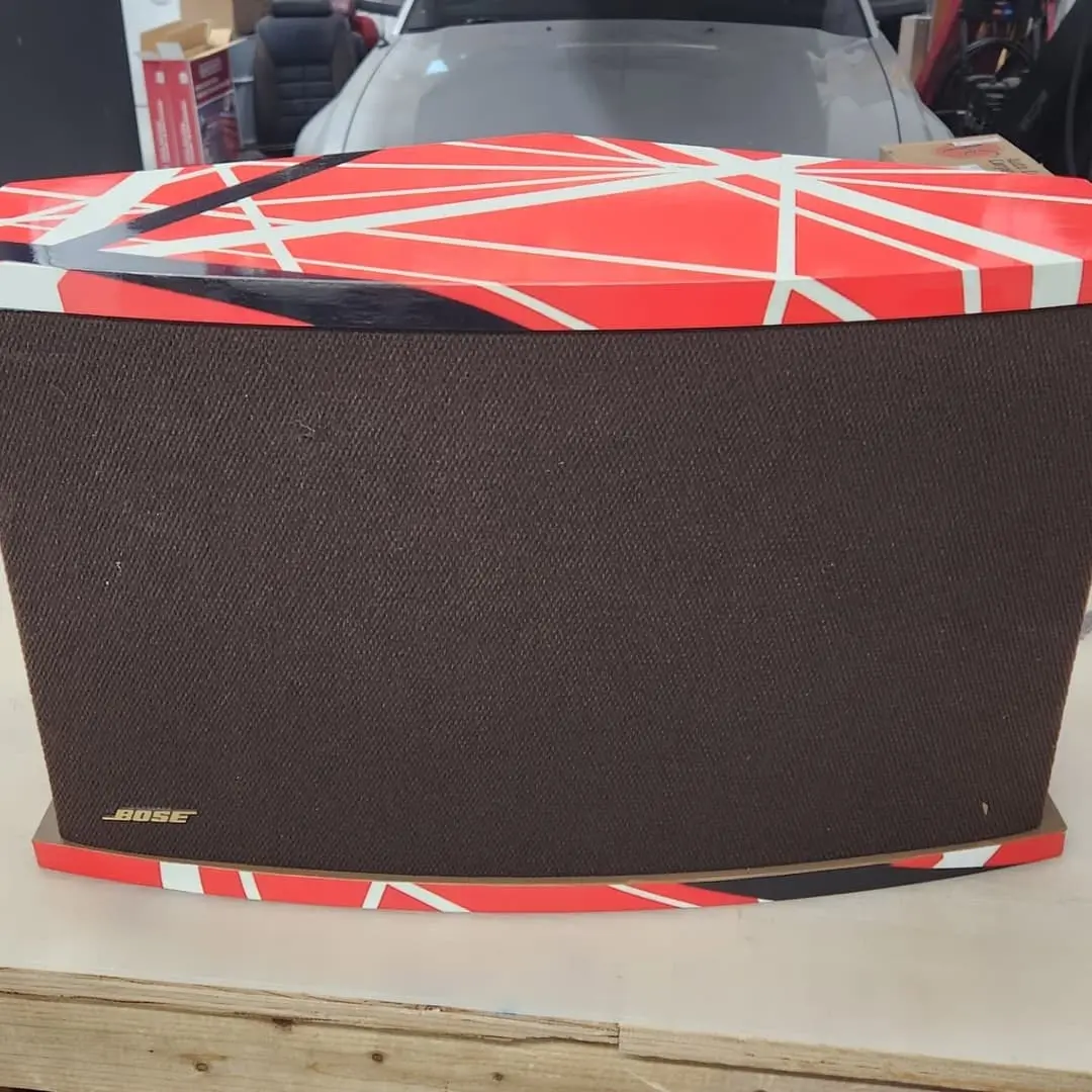 Speaker cabinets wrapped in red, white and black stripes
