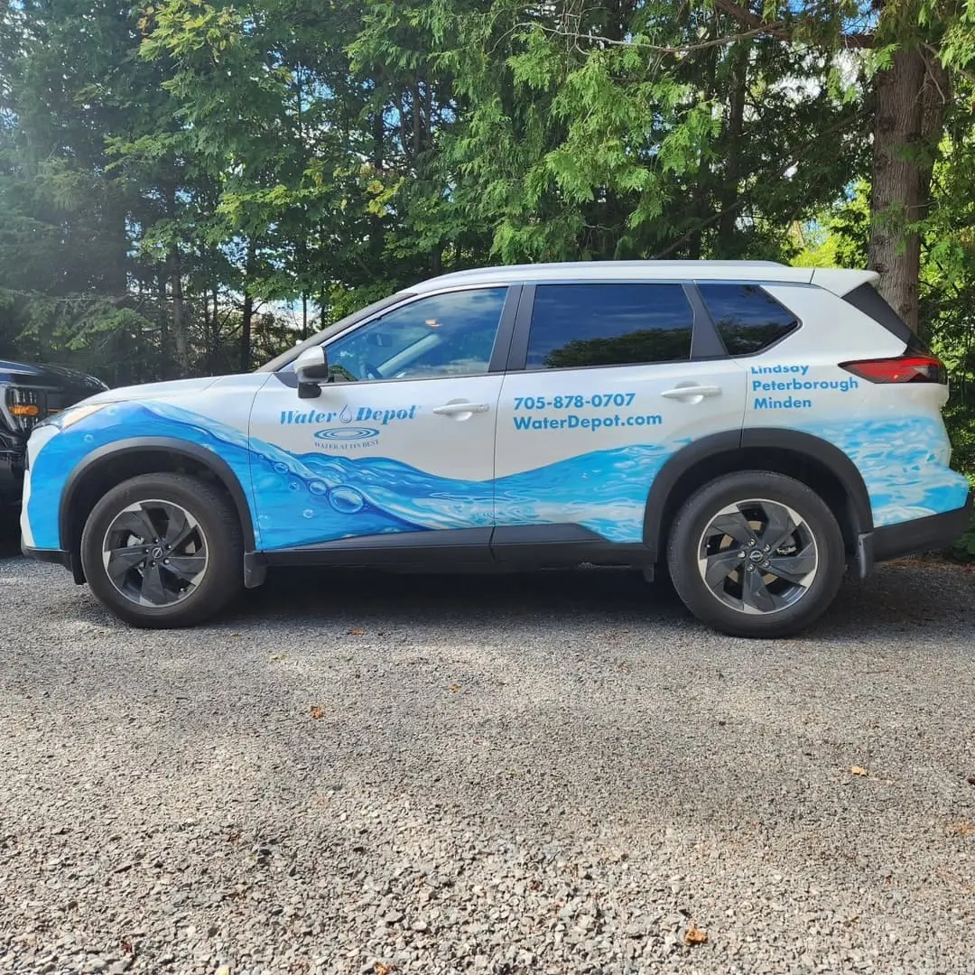 SUV with a blue Water Depot wrap