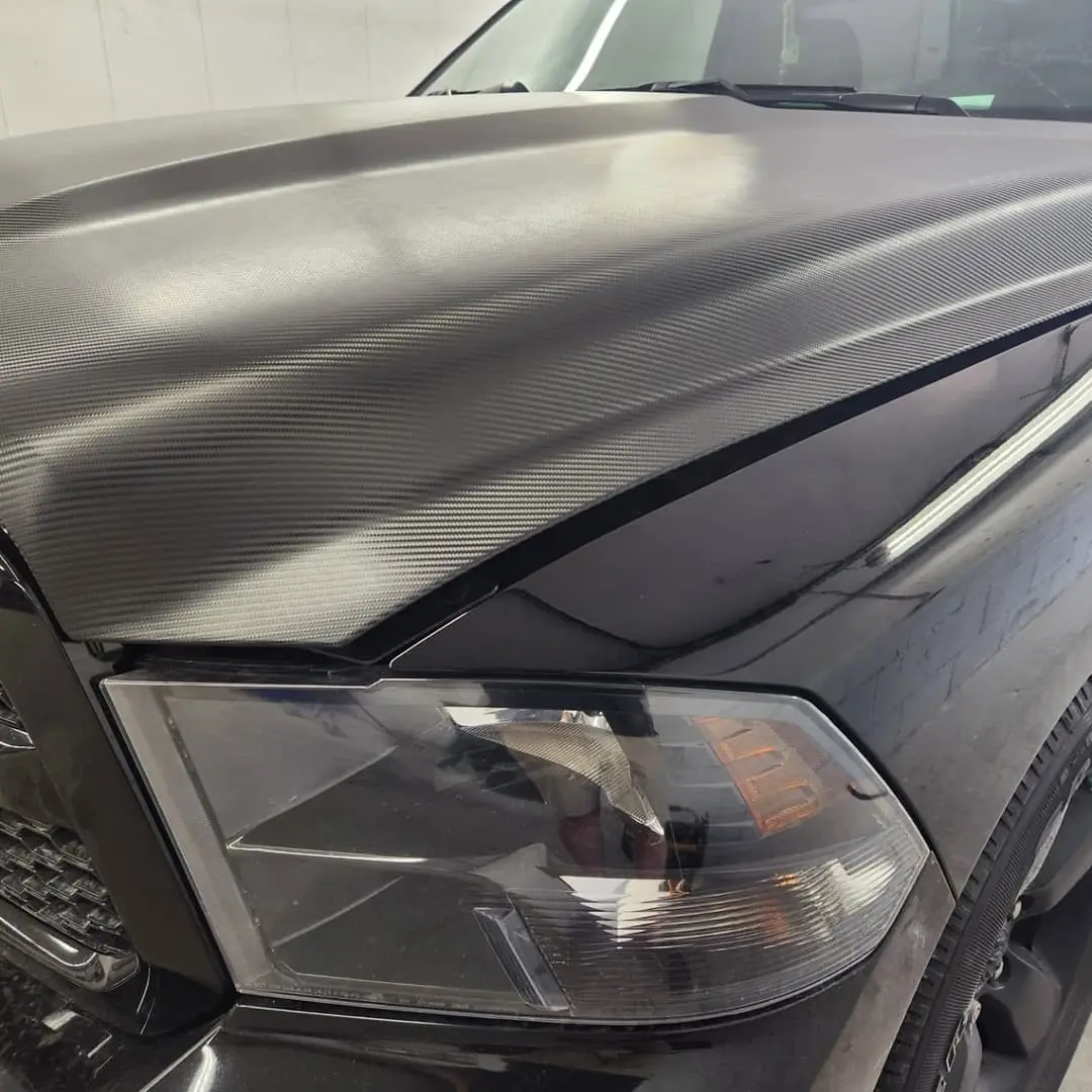 Ram 1500 with a satin black hood wrap