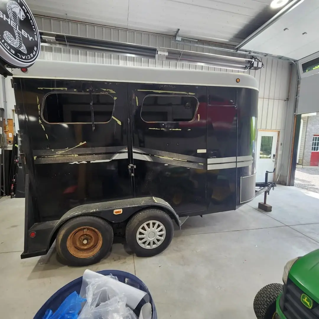 Horse trailer wrapped in black and silver