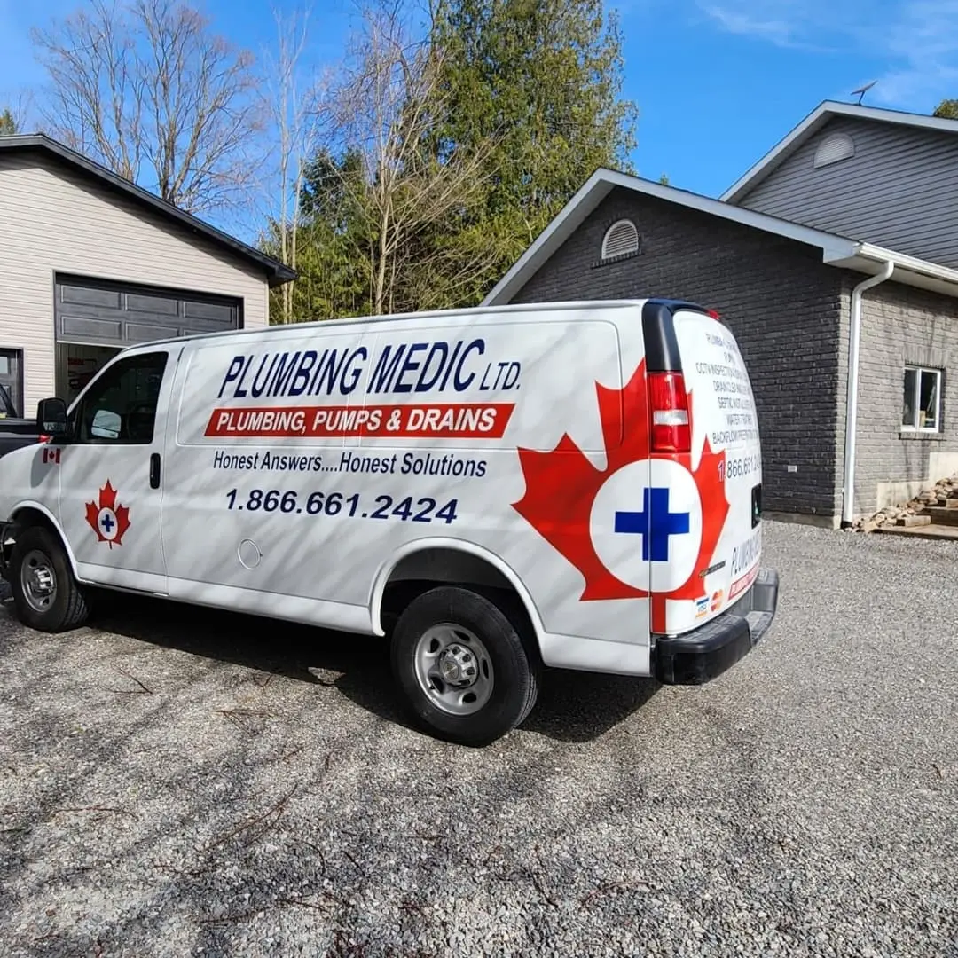 Plumbing Medic van with red maple-leaf graphics