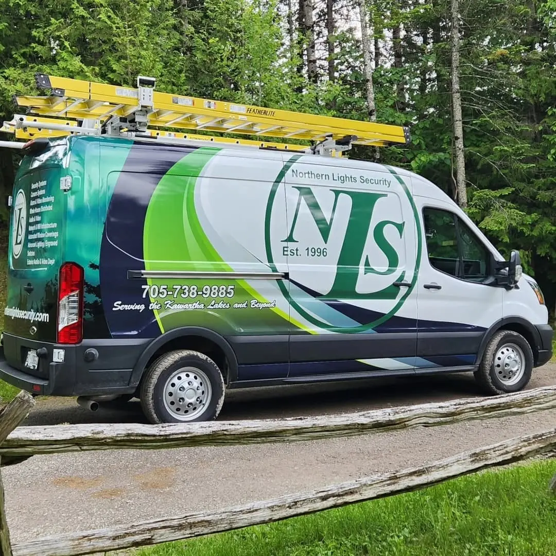 Northern Lights Security van wrapped in green and blue