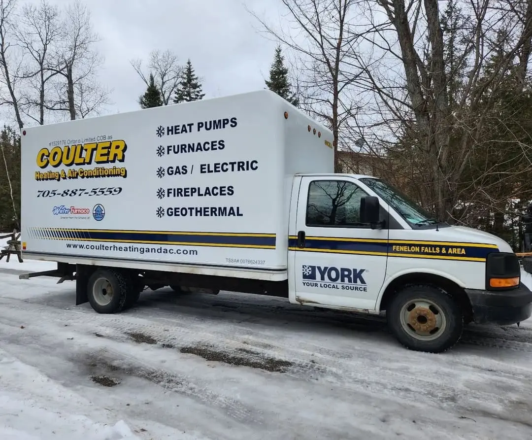 Coulter Heating and Air vans with lettering