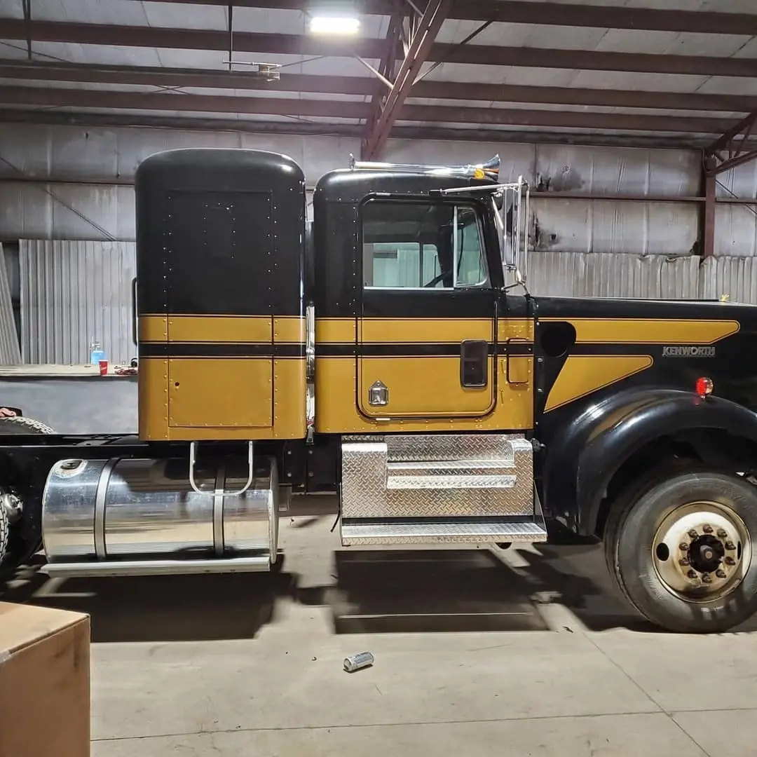 Black Peterbilt with gold striping