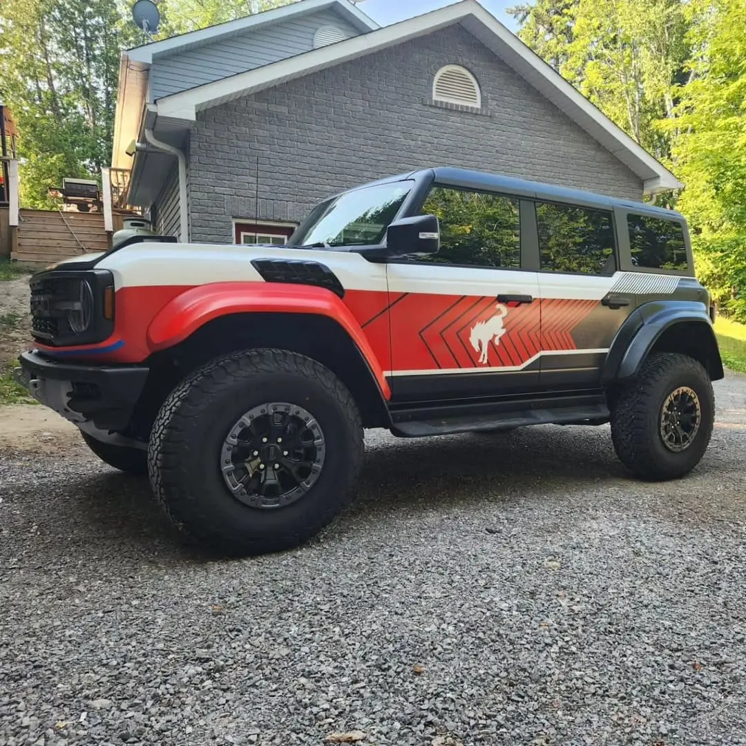 Ford Bronco Raptor with red and black livery graphics