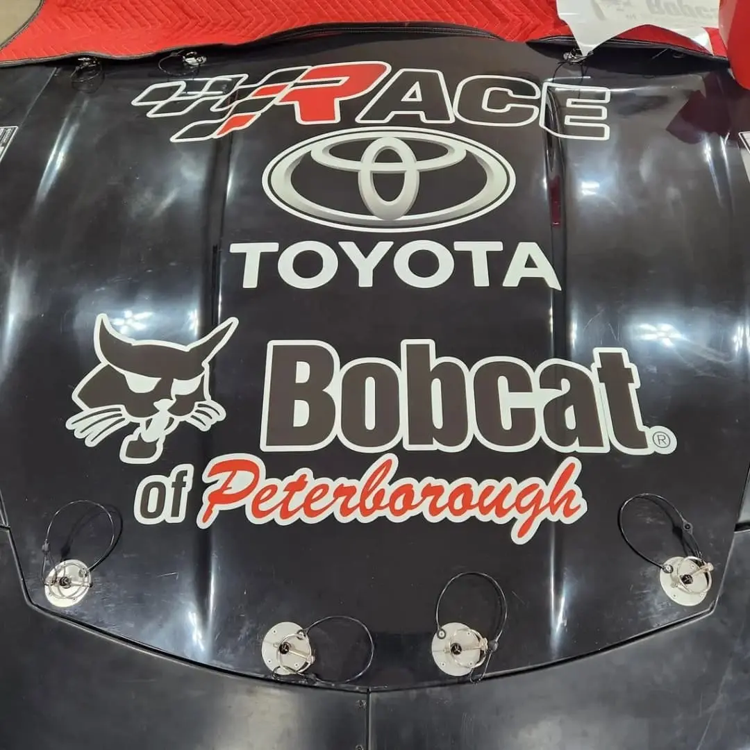 Race car hood with Toyota and Bobcat of Peterborough logos