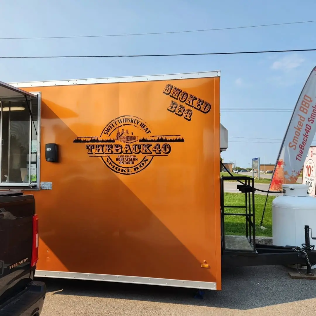 Orange Threadhead BBQ food trailer wrap